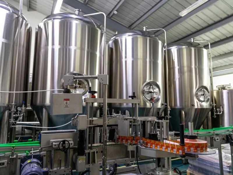 The brewhouse with rows of fermentation tanks